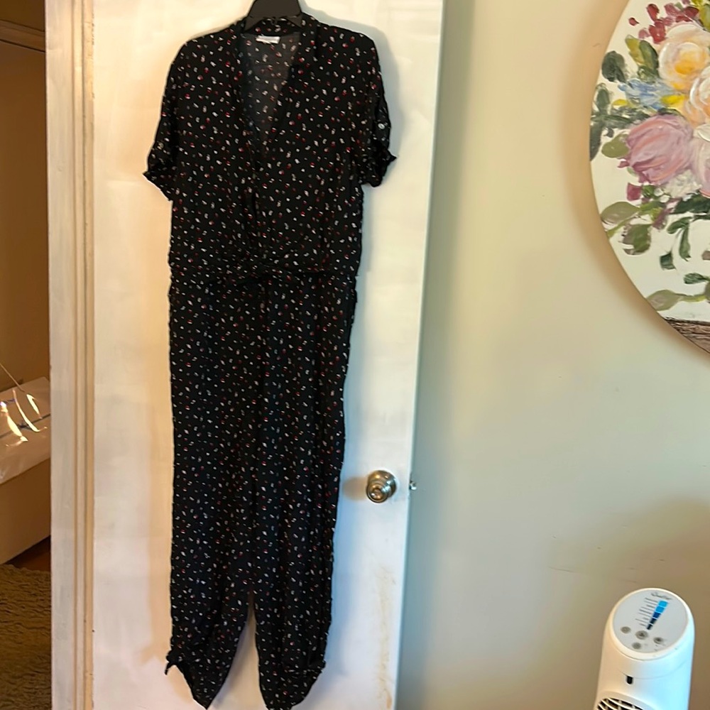 Cute black jumpsuit with red flowers and white leaf accents